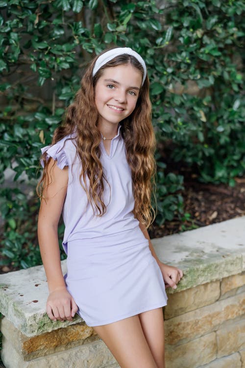 LILA AND HAYES LILA AND HAYES ELLIE GIRLS' SLEEVELESS RUFFLED TOP BY LH SPORT 