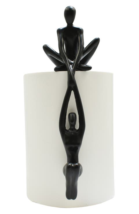 Man Lifting Women onto Ledge Sculpture