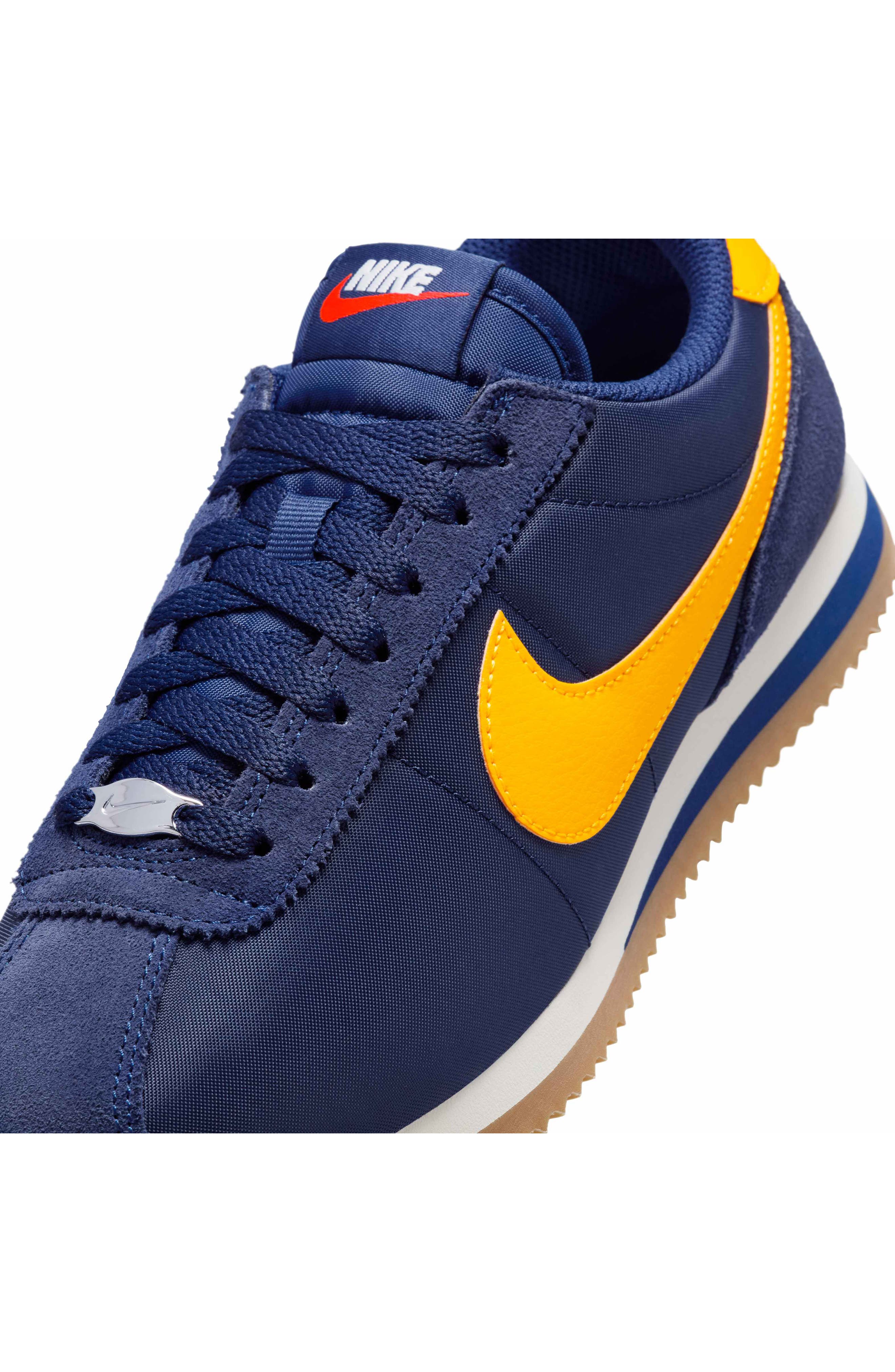 blue and gold nike cortez