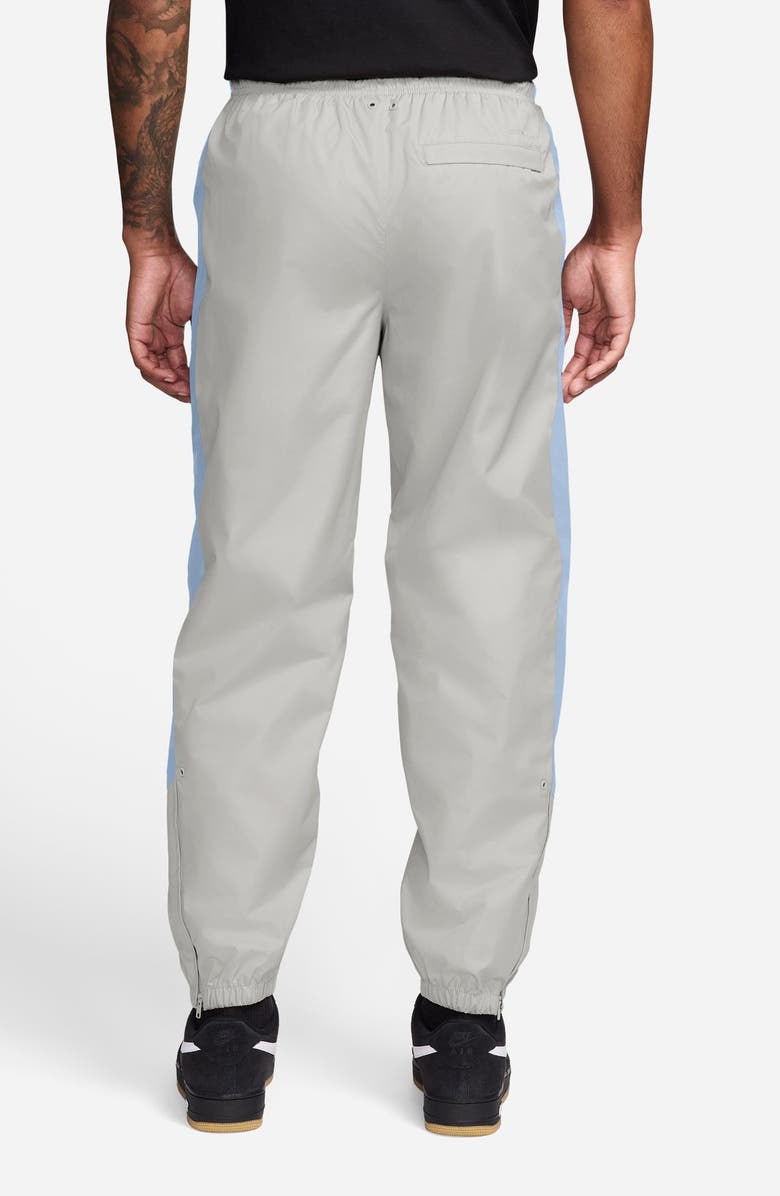 Nike Windrunner Water Repellent Track Pants, Alternate, color, Vast Grey/ Hydrogen Blue