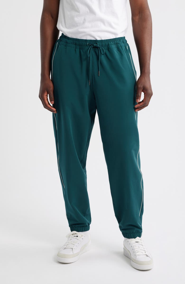 PUMA GOLF x Reigning Champ T7 Track Pants, Main, color, Green Terrain