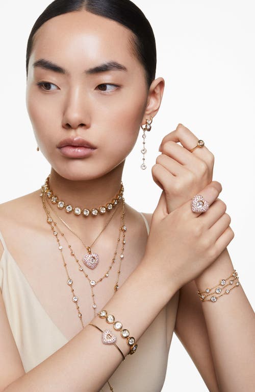 Swarovski Gold-tone Hyperbola Heart Bangle Bracelet In Pink
