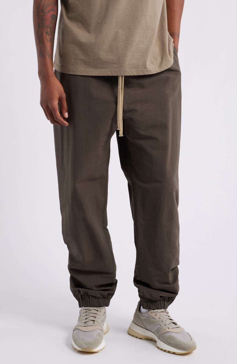 Fear of God Essentials Military Nylon Blend Track Pants, Main, color, 