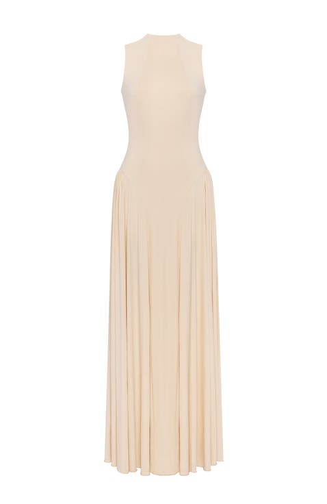Sleeveless mock neck dress with a pleated maxi skirt