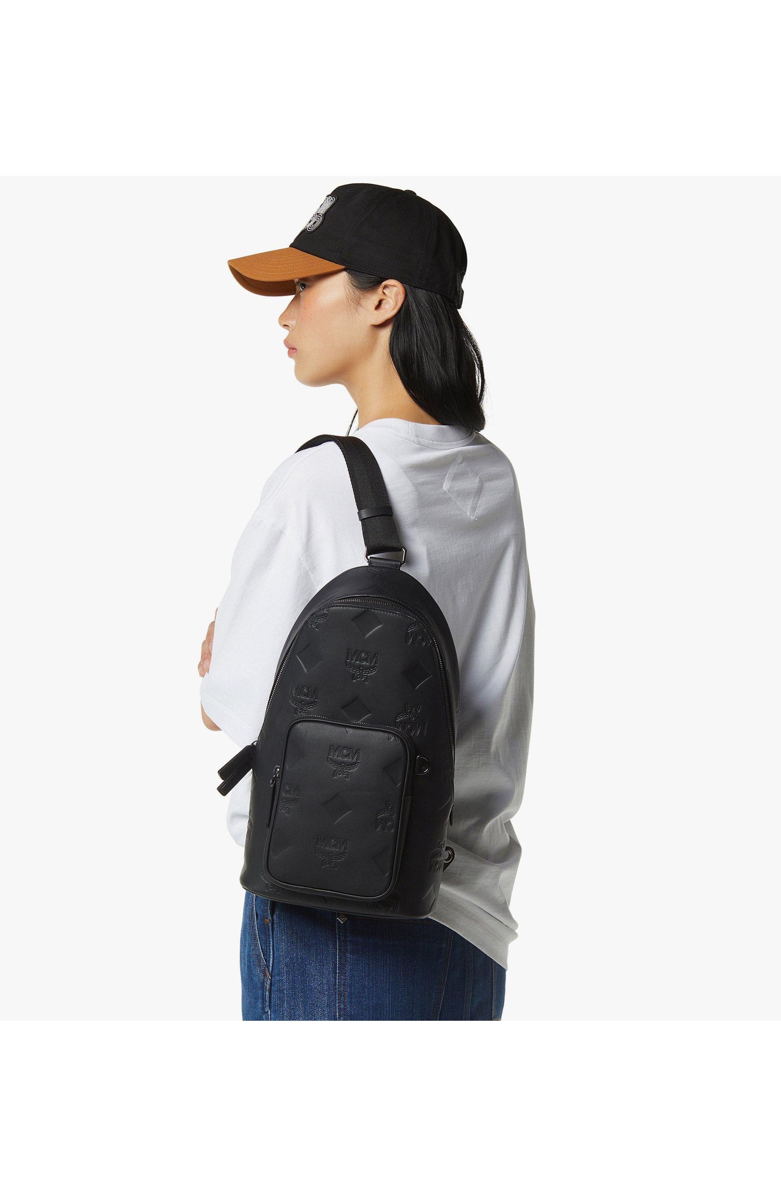 MCM Aren Sling Bag in Embossed Monogram Leather, Alternate, color, Black