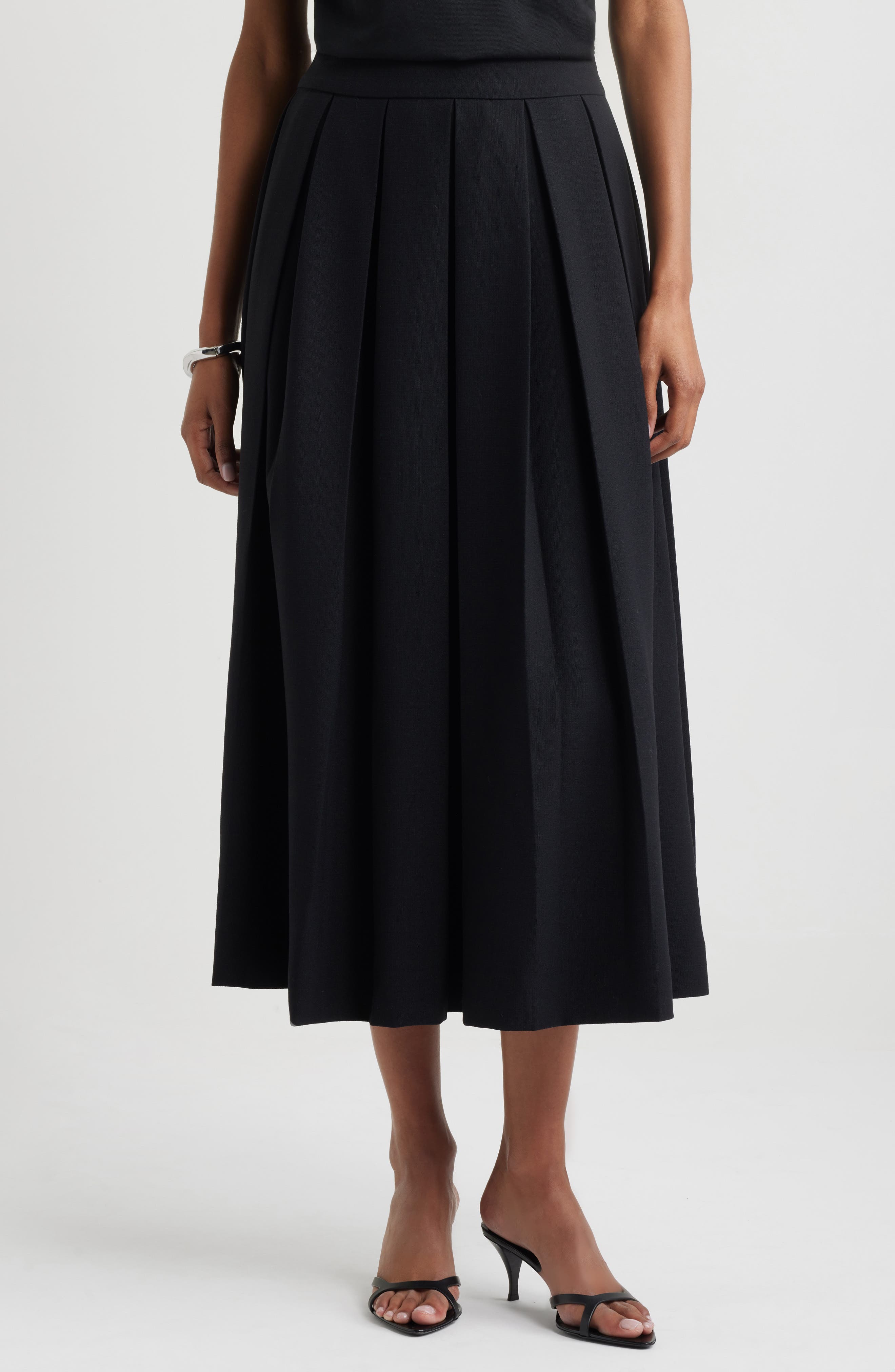 midi length black pleated skirt