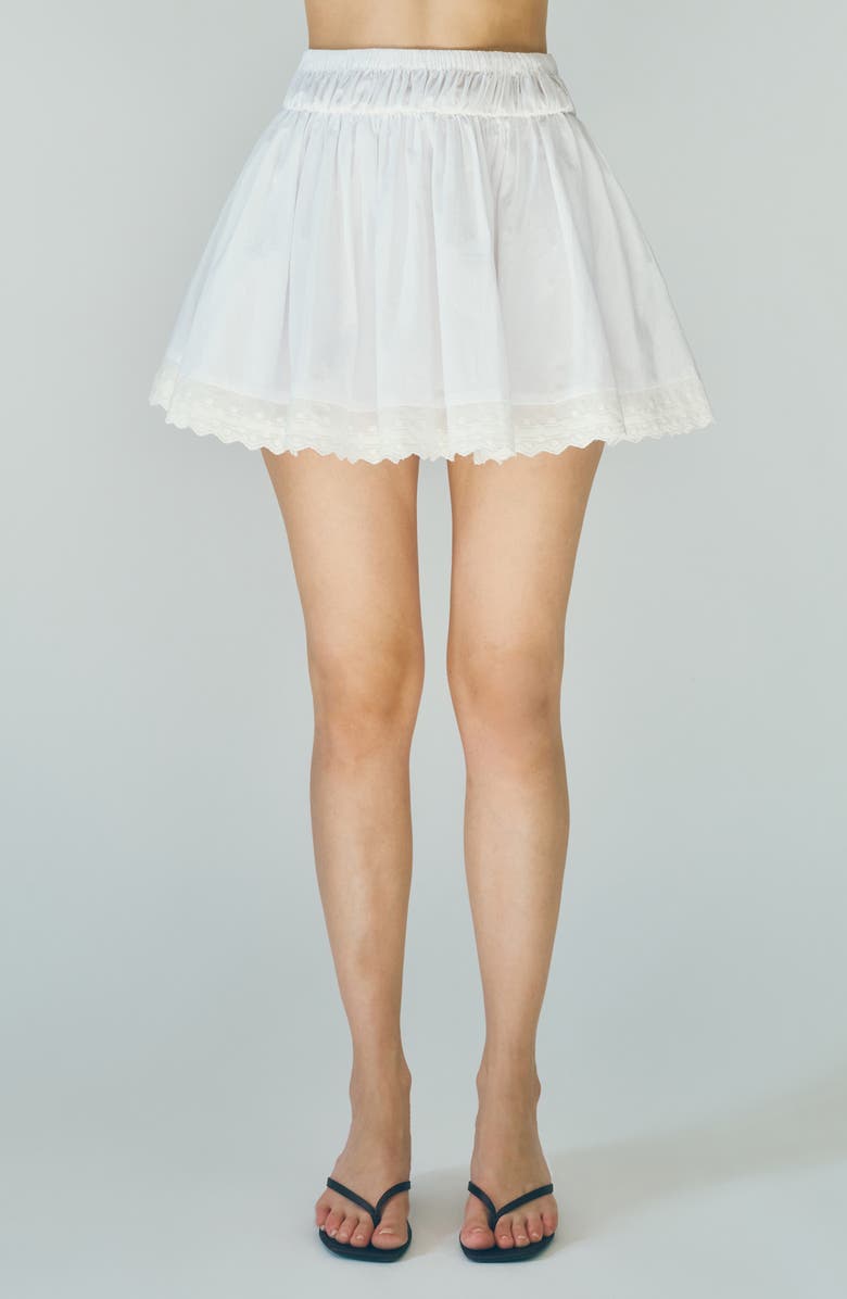 MAUDE CLUB Austin Embroidered Hem Cotton Miniskirt, Main, color, White
