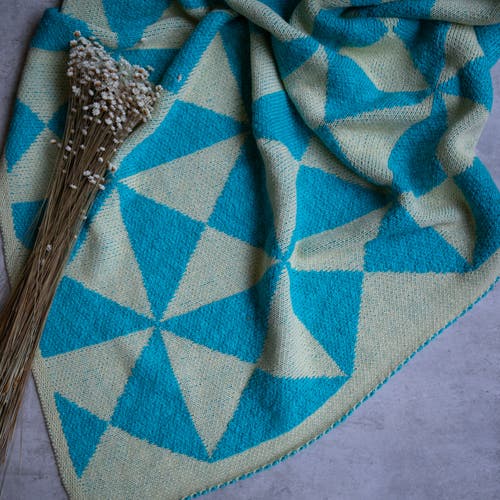 Pink Lemonade Trikona Organic Cotton Throw Blanket in Blue 