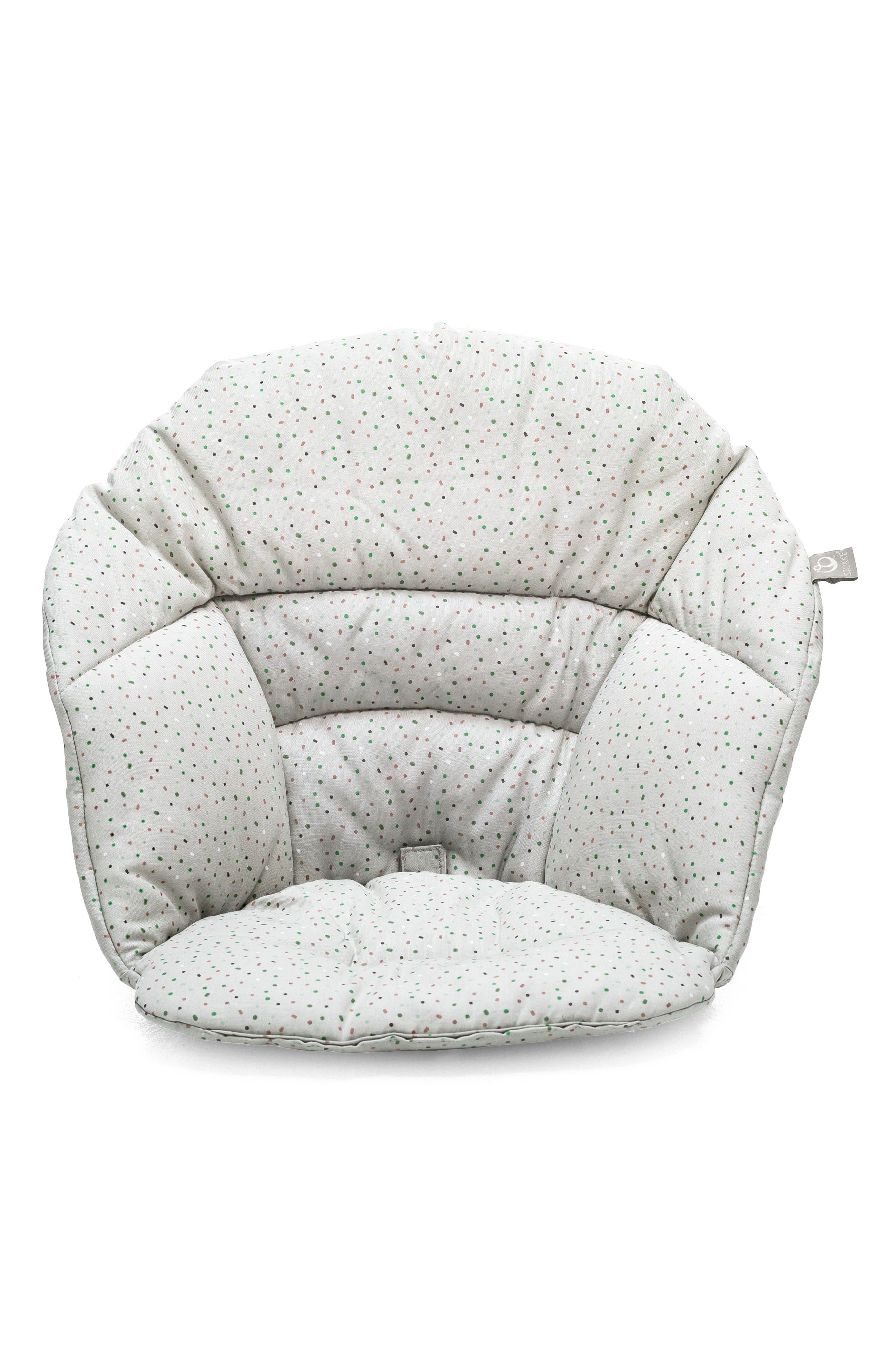 A white bean bag chair with small black dots