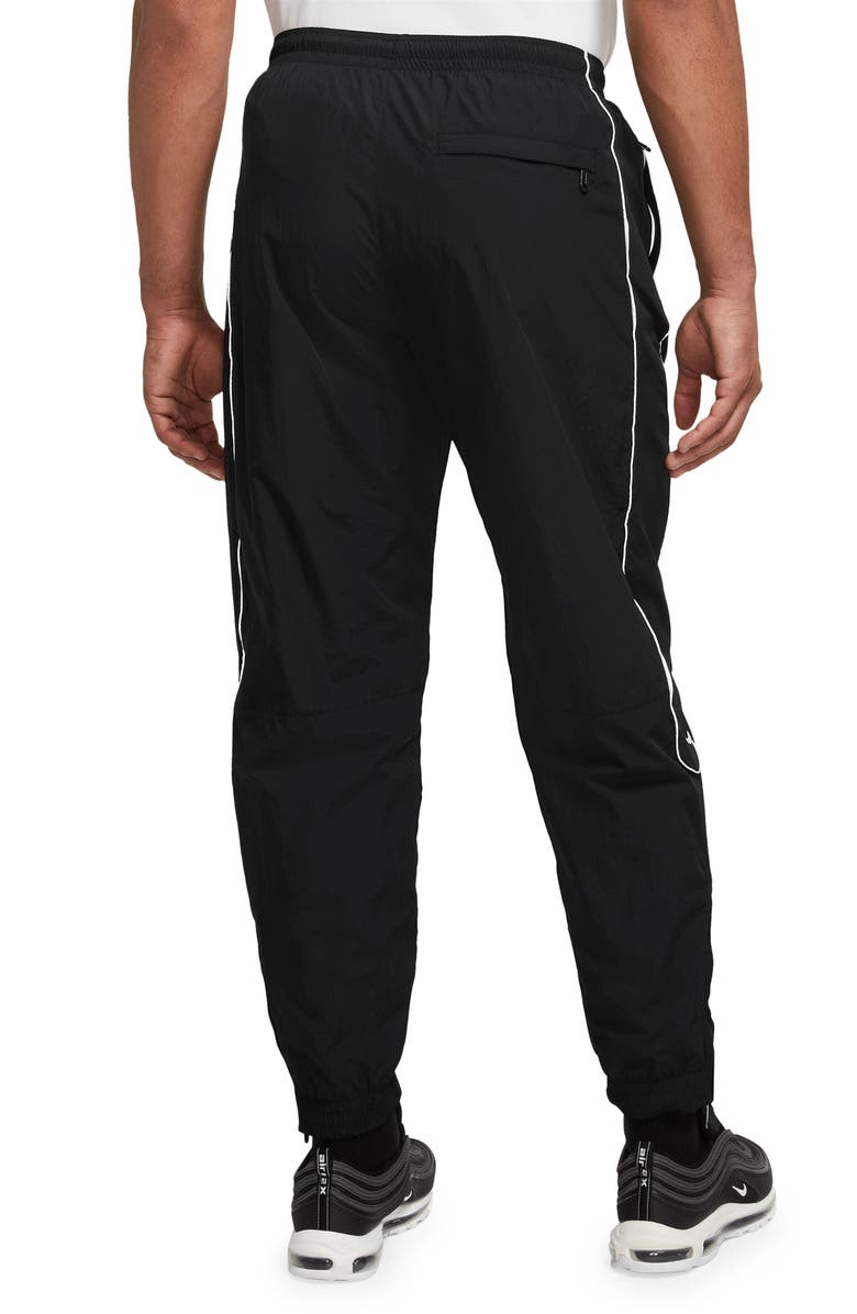 Nike Solo Swoosh Water Repellent Track Pants, Alternate, color, 