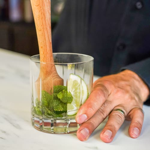 A Bar Above Wooden Cocktail Muddler In Natural