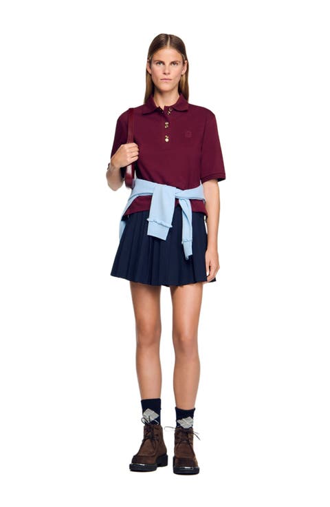 Polo shirt with decorative buttons