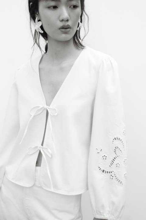 Eyelet-embroidered jacket with tie detail