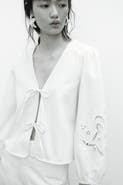 H&M Eyelet-embroidered jacket with tie detail