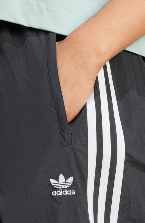 Adidas Originals Adidas Primegreen Essentials Warm-up Slim Tapered 3-stripes Track Pants In Black