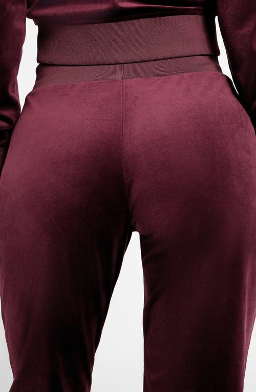Guess Velvet Joggers In Burgundy