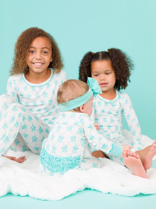 Shop Rufflebutts Softsnooze Girls Ruffle Long Sleeve Pajama Set In Teal Fairytale Bows