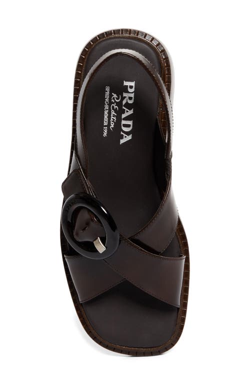 Prada Brushed Leather Crisscross Band Sandals With Plexiglas Buckle In Bruciato