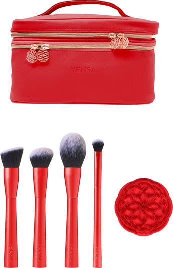 Five red beauty tools and a red carrying case