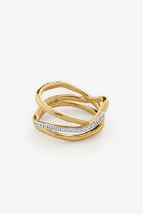 A goldtone ring with an organic shape.